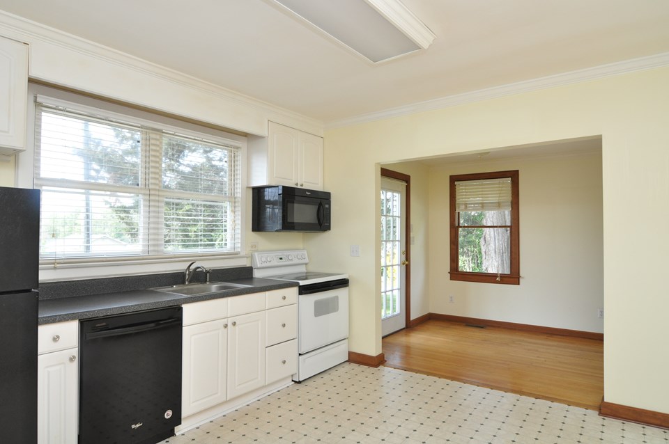 kitchen the eat in kitchen is 11.8 x 12 and has a vinyl floor. there is a dishwasher, smooth top range, microwave and a refrigerator. the counters are laminate and there is a disposal.