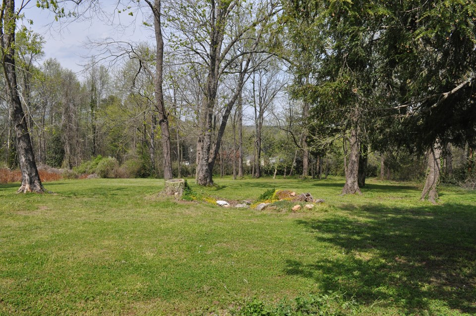 back lots located behind the house on the corner lot are two combined lots that would make a great building site, lying relatively level and dotted with mature trees.  building lots are at a premium in landrum so the extra property can offer options for additional dwellings or privacy.